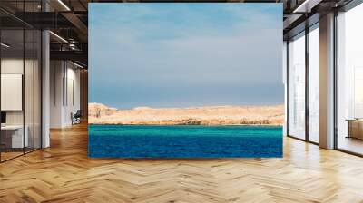 rocky coast of the Red Sea and.blue sky with clouds Wall mural