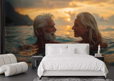 Caucasian old couple in love swim in tropical sea Wall mural