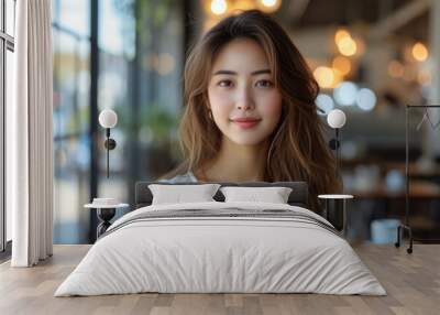 Smiling young woman in cozy cafe environment with soft lighting Wall mural