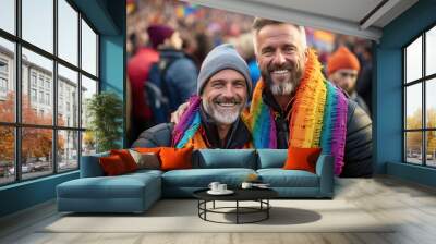 Two mature gay men with rainbow flag at lgbt demonstration Wall mural