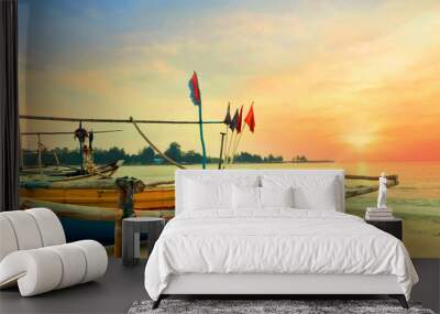 Wooden fishing boat during sunset beach. Wall mural