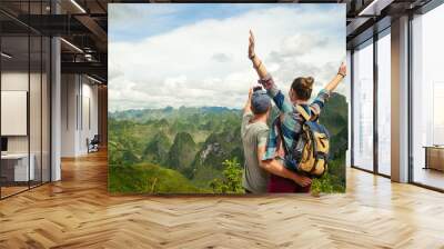 couple of tourists making selfie on background of karst mountains. Wall mural