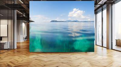 panoramic shot over water of tropical beach. Wall mural