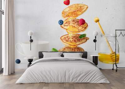 Flying pancakes and berries topped with honey, pancake levitation, Wall mural