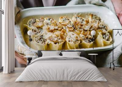 Cannelloni with mushroom stew and chestnuts. Author's Corsican cuisine. Cannelloni in a baking dish Wall mural