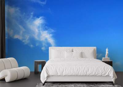 Clear blue sky texture and white fluffy cloud nature background. The sun shines bright in the daytime in summer Wall mural