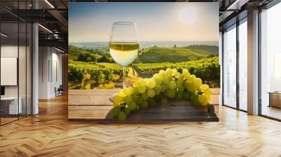 Refreshing Glass of White Wine Amidst Lush Vineyard Grapes on a Sunny Afternoon Wall mural