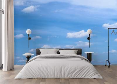 Bright beautiful blue sky with soft clouds, bright sunny day Wall mural