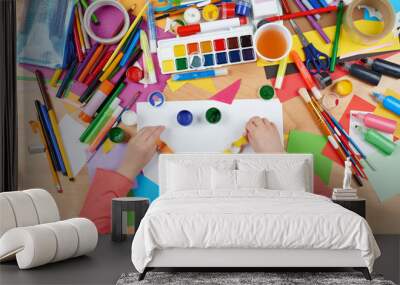 Child cut applique top view. Artwork workplace with creative accessories. Flat lay art tools for painting. Wall mural