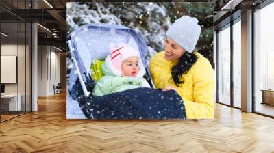 family portrait in the winter forest, mother and baby, bright snowy fir trees, beautiful nature Wall mural