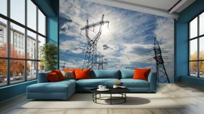 High-voltage electric lines, towers and industrial infrastructure against the blue sky Wall mural