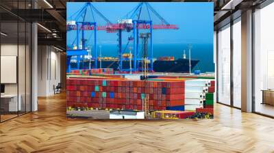 industrial seaport infrastructure, commercial dock and container warehouse, sea, cranes and cargo ship, concept of sea cargo transportation Wall mural