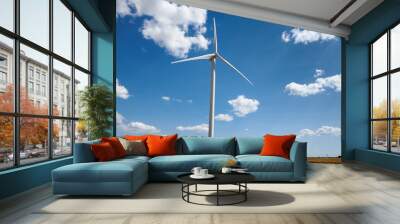 wind generator on bright cloudy sky background Wall mural