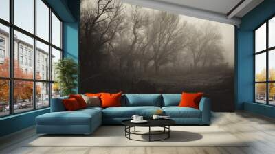 Dark spooky landscape showing forest on a misty winter day in sepia tones Wall mural