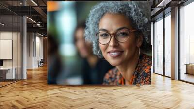 Mature team leader having a discussion with her colleagues in an office, Generative AI Wall mural