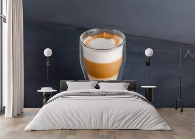 Perfectly gradient latte macchiato view over grey backdrop with copy space. Wall mural