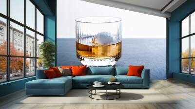 Sphere shaped ice cube and close up whiskey view from studio. Wall mural