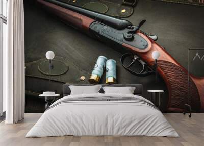 Classic trigger double-barreled hunting rifle on a green background. Smooth-bore hunting rifle open for reloading. Concept postcards for hunters. Wall mural