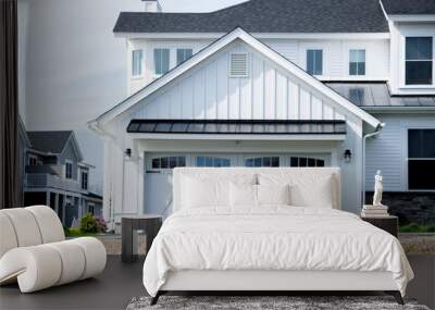 Two cars Garage Door painted in white color in a typical single house. Wall mural