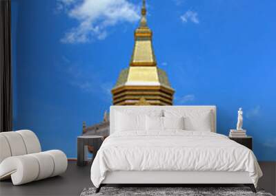 Thai Buddhist pagoda with blue sky background Wall mural