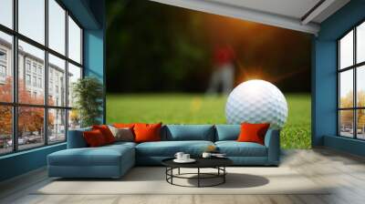 Blurred golf ball on green in beautiful golf course with sunset. Golf ball close up in golf coures at Thailand Wall mural