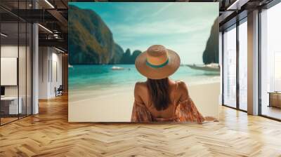 Asian female traveler in summer clothes Relaxing bliss on the sunny beach, Maya Bay, Phi Phi Island Wall mural