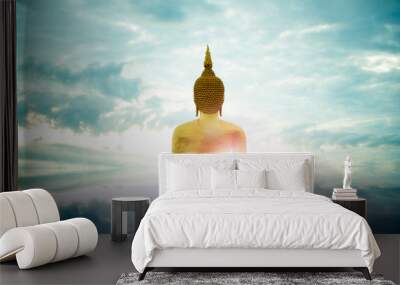 Makha Bucha Day, Visakha Bucha, a large shadow Buddha statue behind a golden sunset in Thailand Wall mural