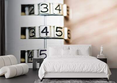 Combination padlock close up with chrome numbers on wooden backg Wall mural