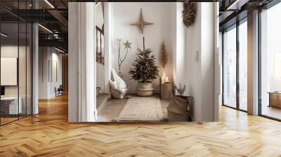 Cozy, minimalist holiday decor in a small hallway with a small decorated Christmas tree and rustic, natural elements. Wall mural