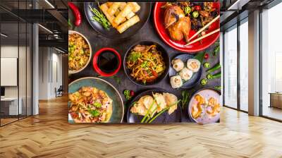 Assorted Chinese food set. Chinese noodles, fried rice, dumplings, peking duck, dim sum, spring rolls. Famous Chinese cuisine dishes on table. Top view. Chinese restaurant concept. Asian style banquet Wall mural