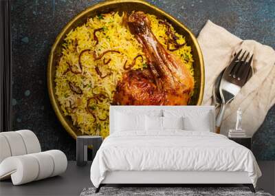 Delicious Indian dish Biryani chicken leg with basmati rice in metal brass old bowl on table stone rustic background. Traditional non-vegetarian food of India Wall mural