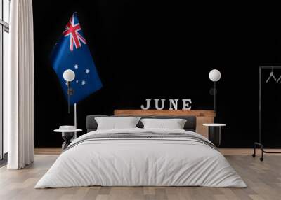 Wooden calendar of June with Australian flag on black background. Holidays of Australia in June Wall mural