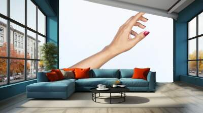 Gesture reaching up woman hand red nail polish. photo isolate on white copy space Wall mural