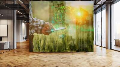 Double exposure business hands using digital tablet with Energy of natural green house, Sustainable and network connection icons on green cityscape. Wall mural