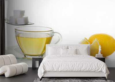 Glass cup of  lemon tea and sugar isolated on white background Wall mural