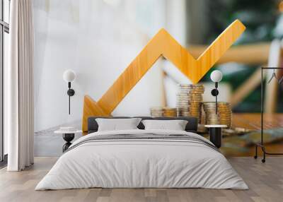 A pile of money and a arrow pointing down symbolizes falling currency and falling interest rates, concepts of inflation and deflation. Wall mural