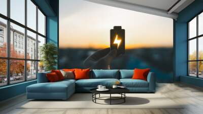 Technology battery high power electric energy with a connected charging cable. Battery to electric cars and mobile devices with clean electric, Green renewable energy battery storage future. Wall mural