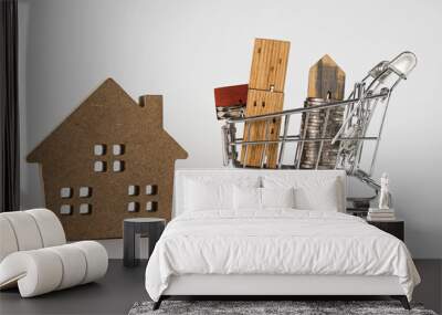 Wood house model in shopping cart on white background. Real Estate market, Trading Estate, Mortgage Concepts Wall mural