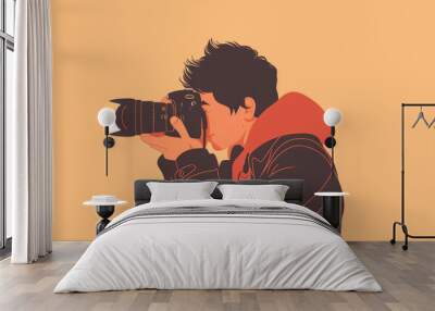 A young individual dressed in casual clothing focuses on taking pictures with a camera against a bright backdrop Wall mural