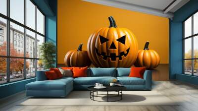 Halloween pumpkin with carved face and two little pumpkins on yellow background Wall mural