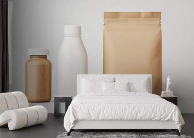 Three containers are displayed: two bottles, one dark and one white, alongside a kraft paper bag, showcasing a minimalist aesthetic. Wall mural