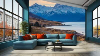 Colorful sunset scenery of Aoraki Mount Cook national park in autumn in south island, New Zealand. Snow moutain with lake and road. Wall mural