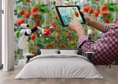 Farmer holding a tablet smart arm robot harvest work agricultural machinery technology Wall mural