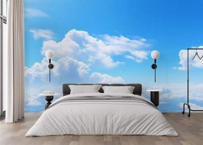 A clear day with a blue sky and fluffy cumulus clouds Wall mural