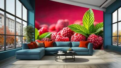 Close-up of red raspberries on red background with green leaves in background, red, raspberries, fresh, fruit, sweet, juicy Wall mural