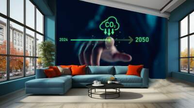 Businessman point to increasing arrow with carbon reduction for decrease CO2, carbon footprint and carbon credit to limit global warming from climate change, Bio Circular Green Economy concept. Wall mural