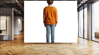 A 9 year old boy wearing jeans and an orange sweater seen from the back standing upright on a transparent background Wall mural