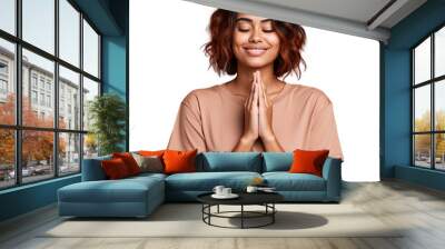 Relaxed young Hispanic woman in casual attire meditating with closed eyes showcasing yoga principles Wall mural