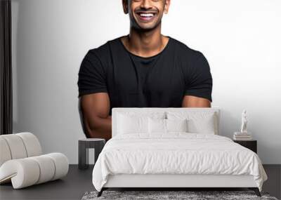 Studio portrait of joyful young man in casual attire Attractive Indian man with contemporary haircut in black shirt standing with arms crossed alone against transparent background gazing at  Wall mural