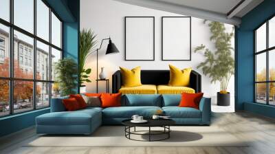 Two vertical empty black frames, a yellow chester velvet sofa, plants in pots and baskets, lamps, and an empty white floor with a white wall serve as the background in this mock-up of a living room Wall mural